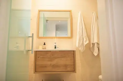 a bathroom with a sink and a mirror at Casa Coral in Miami