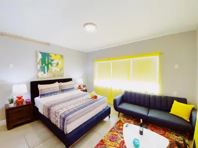 a bedroom with a bed and a couch at Miami International by Lowkl in Miami Beach