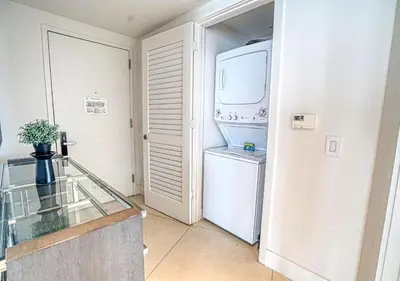 a kitchen with a white refrigerator and a washer and dryer at Life Resort on Miami Hollywood BeachFront by MRA in Hollywood