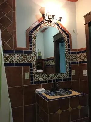 a bathroom with a sink and a mirror at Heavenly Suite in Little Havana Free Parking in Miami