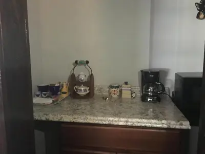 a kitchen counter with a coffee maker on it at Private room in the Heart of Little Havana in Miami