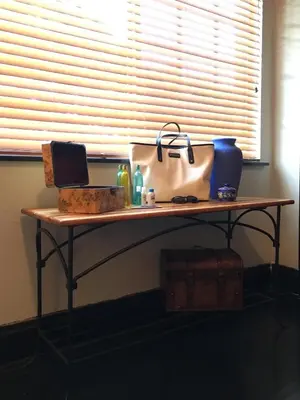 a table in a room with a window and a table withentials at Private room in the Heart of Little Havana in Miami