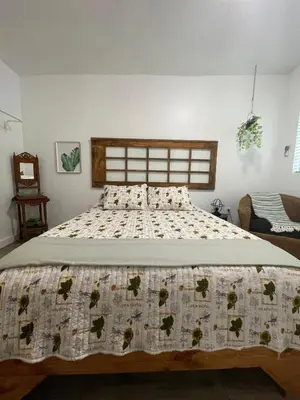 a bedroom with a bed with a quilt on it at Studio close to Everything in Miami