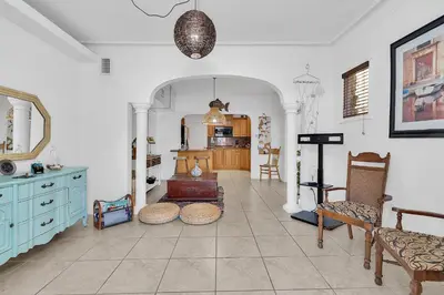 a living room with a table and some chairs at Coral Suite close to Little Havana in Miami