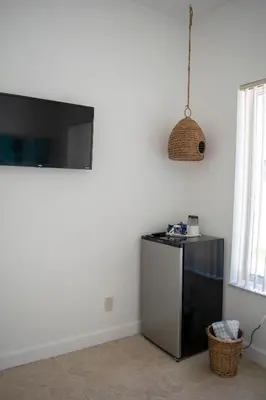 a kitchen with a small refrigerator in a room at Stay Near Miami's Cultural Heart With Wifi in Miami