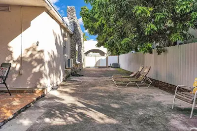 a patio with two chairs and a fence at Private Studio in Little Havana in Miami