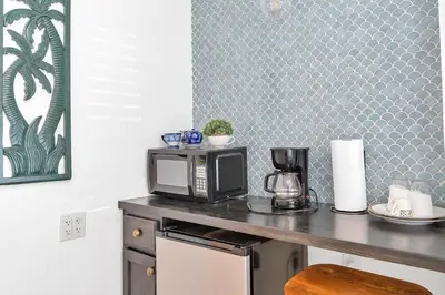 a microwave sitting on a counter in a kitchen at Private Studio in Little Havana in Miami