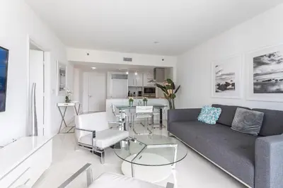 a living room with a couch and a table at ** W ICON BRICKELL-LUXURY UNIT- FREE SPA** in Miami