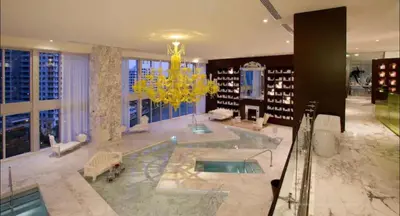 a large bathroom with a tub and a chandelier at ** W ICON BRICKELL-LUXURY UNIT- FREE SPA** in Miami