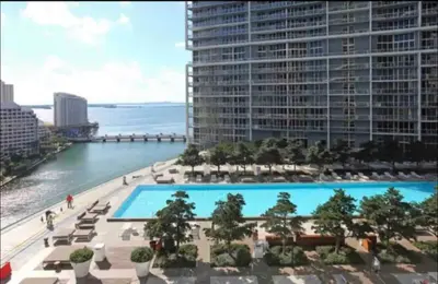 a view of a large swimming pool from a building at ** W ICON BRICKELL-LUXURY UNIT- FREE SPA** in Miami