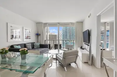 a living room with a couch and a table at ** W ICON BRICKELL-LUXURY UNIT- FREE SPA** in Miami