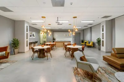 a lobby with tables and chairs and a waiting room at Elite Brickell Studio on the Bay in Miami