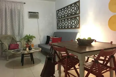 a living room with a table and a couch at 1 Bedroom Apt near Coconut Grove in Miami