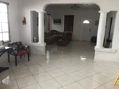 a large living room with couches and a table at Cozy Room in the Heart of Little Havana in Miami