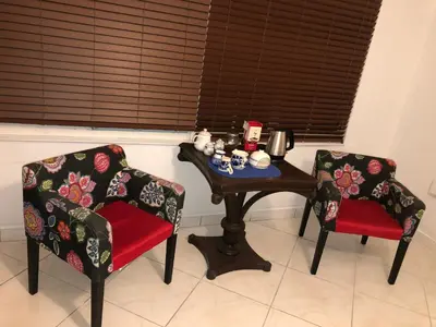 two chairs and a table and a table and chairs with a table and a table at Cozy Room in the Heart of Little Havana in Miami