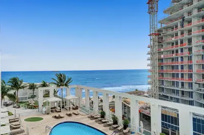 a view of the ocean from the balcony of a building at Coastal studio w hot tub gym access in Fort Lauderdale