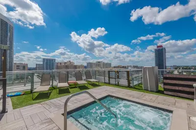 a rooftop hot tub on the roof of a building at Ocean view 1 bed- Steps from the beach! in Hallandale Beach