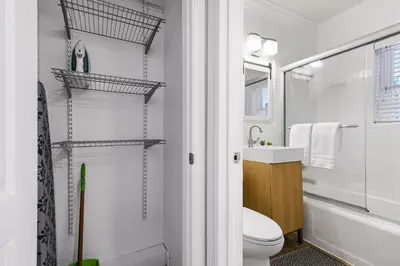 a bathroom with a toilet and a sink and a shower at Alani Bay Villas in Fort Lauderdale