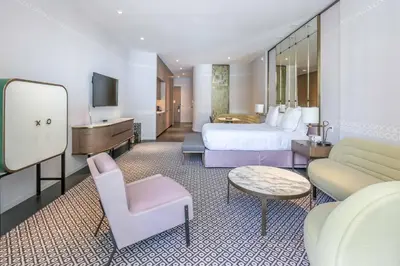 a hotel room with a bed and a desk at Aluna Lux Suites at SLS Lux Brickell Building in Miami