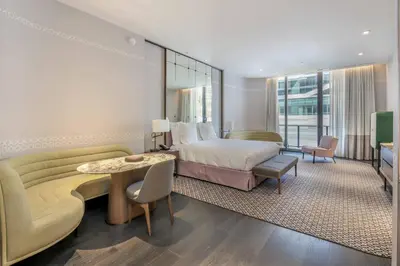 a hotel room with a bed and a couch at Aluna Lux Suites at SLS Lux Brickell Building in Miami