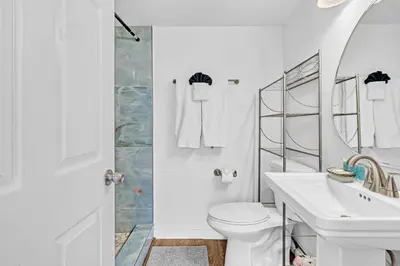 a white bathroom with a sink and a toilet at 1 bedroom in the BEST location in South Beach ! in Miami Beach