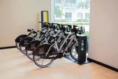 a row of bikes parked in a room at AC Hotel by Marriott Fort Lauderdale Airport in Dania Beach