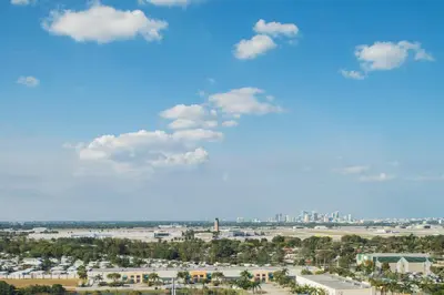 a view of a city with a blue sky and clouds at Marriott Fort Lauderdale Airport in Dania Beach
