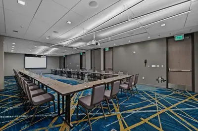 a large conference room with a long table and chairs at Marriott Fort Lauderdale Airport in Dania Beach