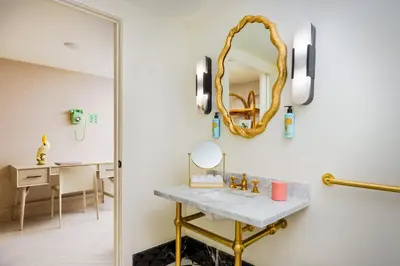 a bathroom with a sink and a mirror at The Goodtime Hotel, Miami Beach a Tribute Portfolio Hotel in Miami Beach