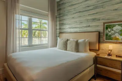 a bedroom with a large bed and a window at Iberostar Waves Miami Beach in Miami Beach