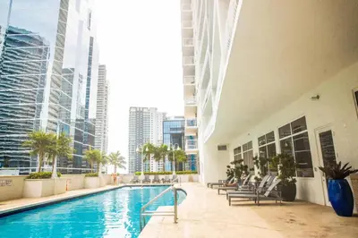 a swimming pool in a building with tall buildings at Modern and Luxurious Brickell Studio in Miami