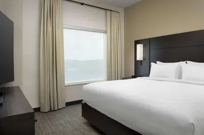 a bedroom with a large bed and a window at Residence Inn Doral Mall Area in Doral