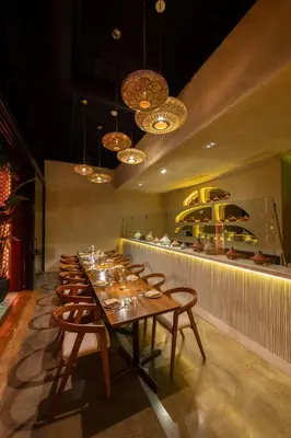a long dining room with a long table and chairs at Sentral Wynwood in Miami
