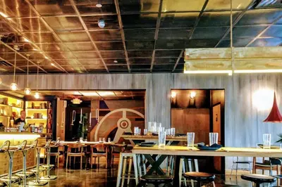 a restaurant with tables and chairs in a room at Downtown Miami Brickell Bay & Pool View 4 Bedrooms in Miami