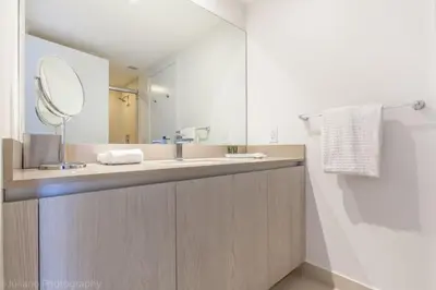 a bathroom with a sink and a mirror at Hyde Beach Luxury Condo-Resort condo in Hollywood Beach