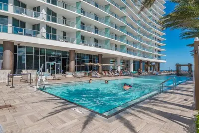 a swimming pool in front of a hotel at Hyde Beach Luxury Condo-Resort condo in Hollywood Beach