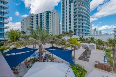 a view of a resort with palm trees and buildings at Hyde Beach Luxury Condo-Resort condo in Hollywood Beach