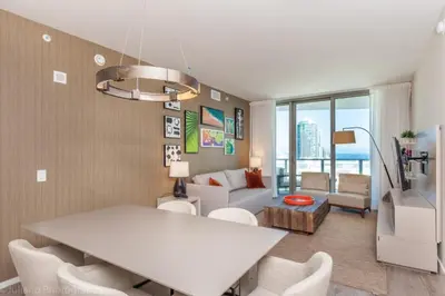 a living room with a white table and chairs at Hyde Beach Luxury Condo-Resort condo in Hollywood Beach