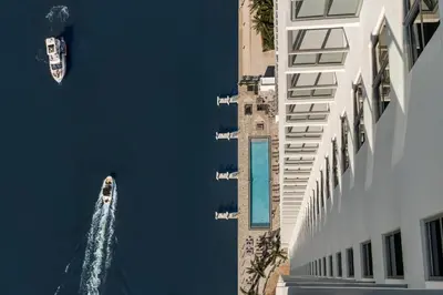 a boat in the water next to a building at HYDE HOUSE 1906 HALLENDER MIAMI in Hollywood