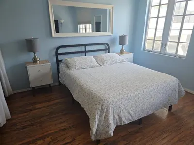 a bedroom with a bed and a mirror on the wall at *530 BEACH PAD-OCEAN DRIVE* in Miami Beach