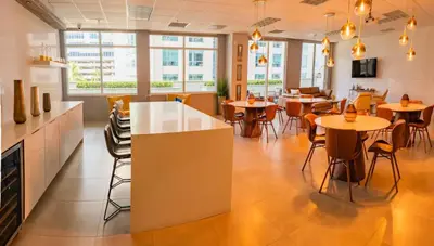 a restaurant with tables and chairs in a room at Luxurious 1 Bed Apartment • Brickell • Ocean Views in Miami