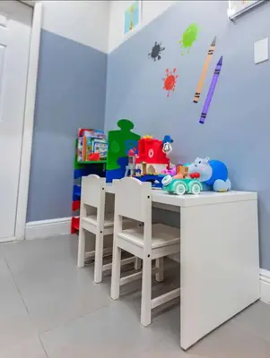 a dining room with a table with chairs and toys at Luxurious 1 Bed Apartment • Brickell • Ocean Views in Miami