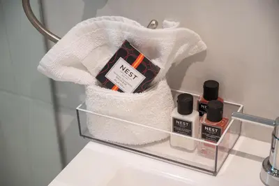 a towel rack with soap and other products on a sink at Casa Del Mar Master in Hollywood