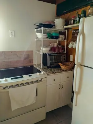 a kitchen with a stove and a refrigerator at Cozy apartment in quite zone in Hollywood