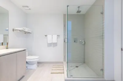 a bathroom with a shower and a toilet at Hyde Beach House Luxury Condo-Resort condo in Hollywood Beach