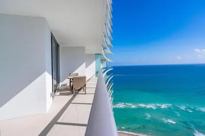 a view of the ocean from the balcony of a building at Hyde Beach Luxury Condo-Resort apts in Hollywood Beach