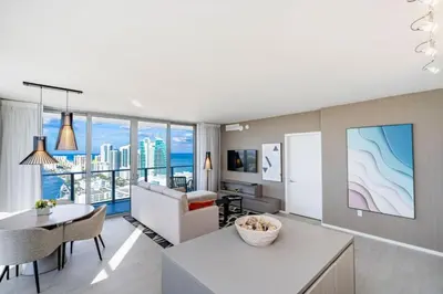 a living room with a dining table and a living room at Hyde Beach House Luxury Condo-Resort condo in Hollywood Beach