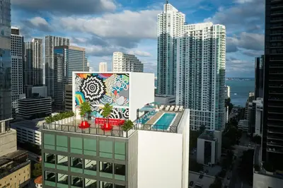 a mural on the side of a building in a city at citizenM Miami Brickell in Miami