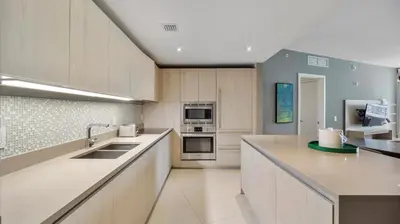 a kitchen with a sink and a stove top oven at 2 bed rental on the beach15th floor Hollywood Miami in Hallandale Beach