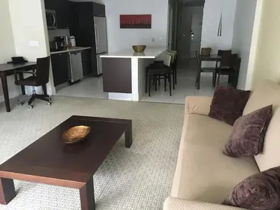 a living room with a couch and a table at Doral 2-Story Villa 3 Bed 4 Bath at Provident Doral at The Blue Miami in Miami